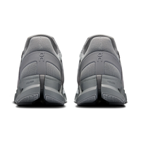 Gray athletic shoes with 'On' branding on a white background