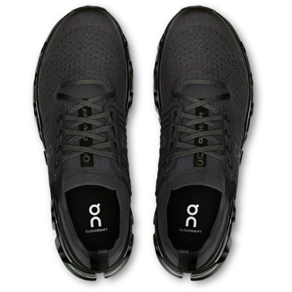 Black running shoes with 'on' logo on a white background