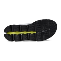 Close-up of a black shoe sole with a white background