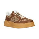 Gucci GG Canvas Leather-Trimmed Sneakers on feet Dubai