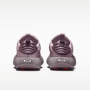Pair of purple children's shoes on a white background