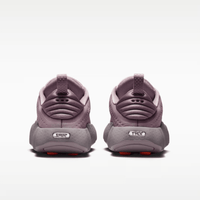 Pair of purple children's shoes on a white background