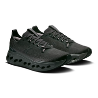 On Cloudsurfer Max Black Eclipse on feet Dubai