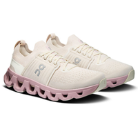 White and pink athletic shoes with a unique sole design on a white background
