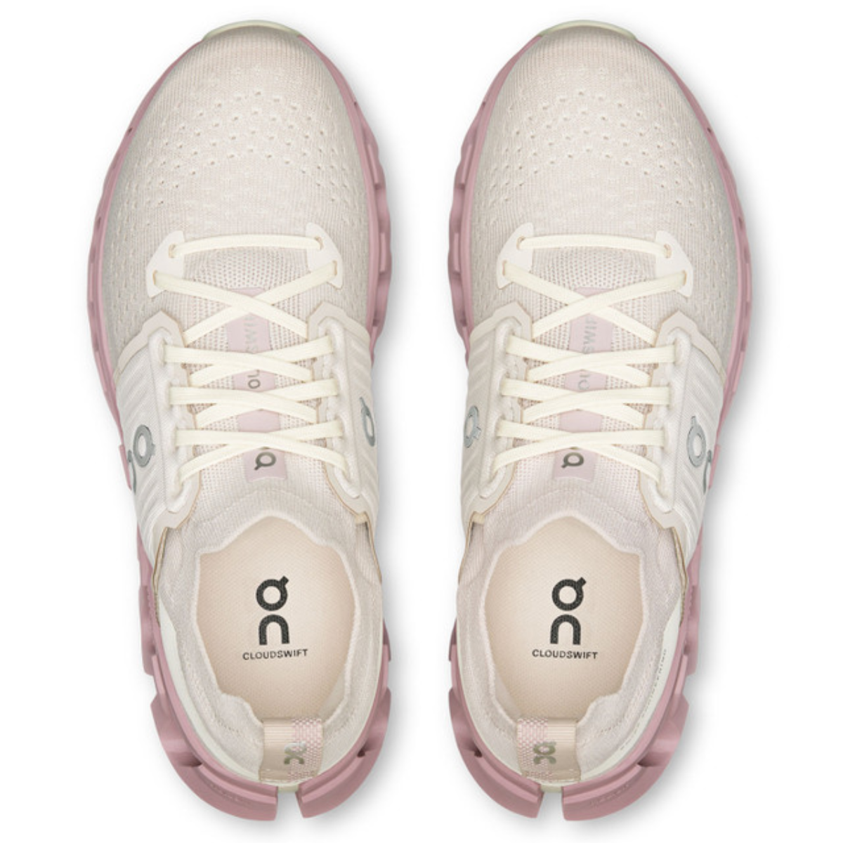 White and pink athletic shoes with visible brand logo on a white background