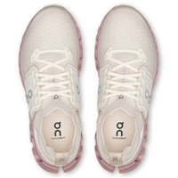 White and pink athletic shoes with visible brand logo on a white background