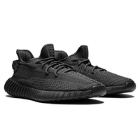 Yeezy Boost 350 V2 Black Static sneakers on feet Dubai