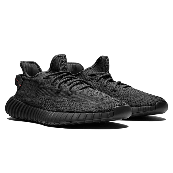 Yeezy Boost 350 V2 Black Static sneakers on feet Dubai