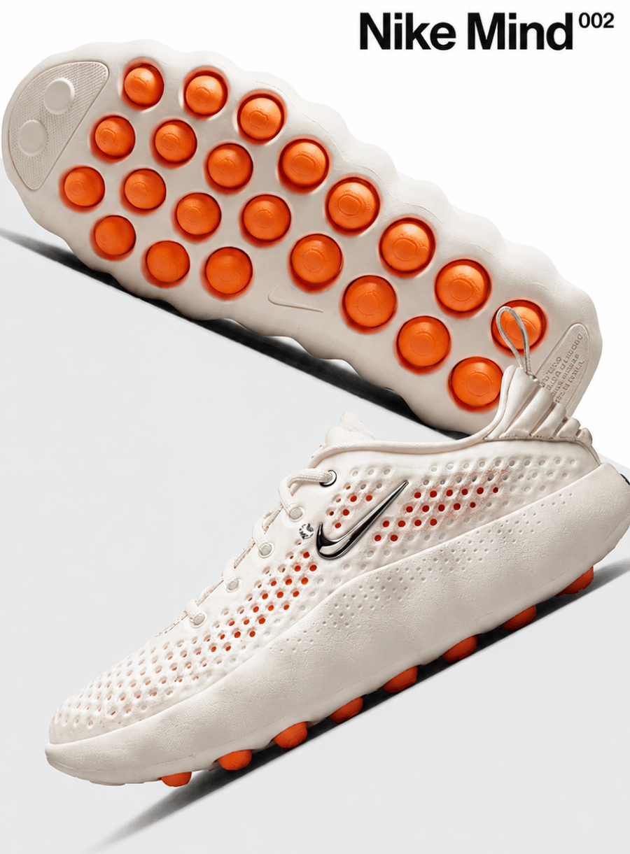 White sneaker with orange sole and Nike logo on a light gray background